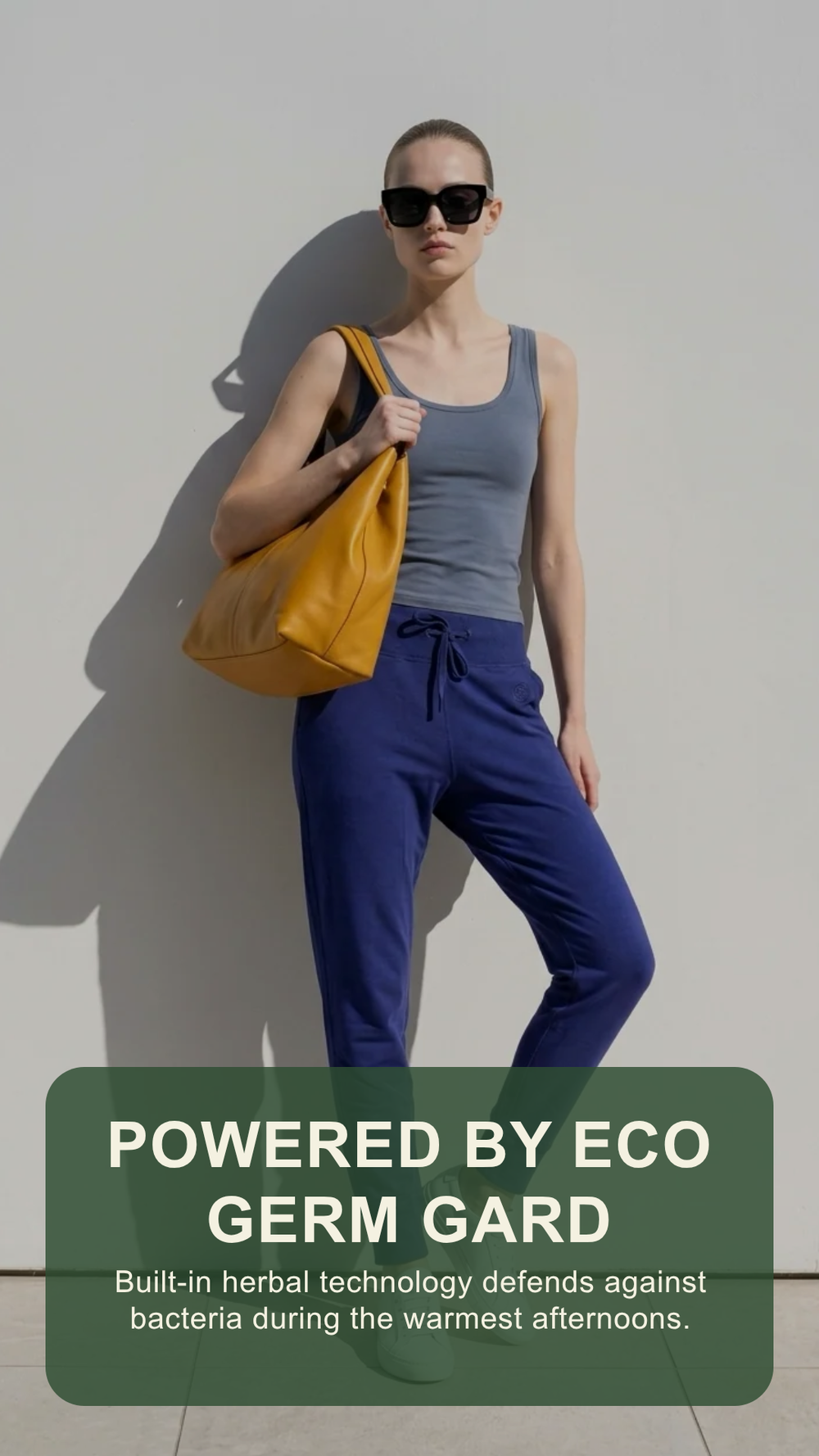 Woman wearing Umi Jogger in blue by Eco Golden Comfort — Powered by Eco Germ Gard herbal bamboo technology"
